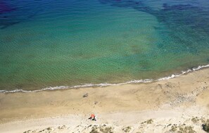 On the beach, sun loungers, beach towels