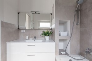 Bathtub, bidet, toilet paper