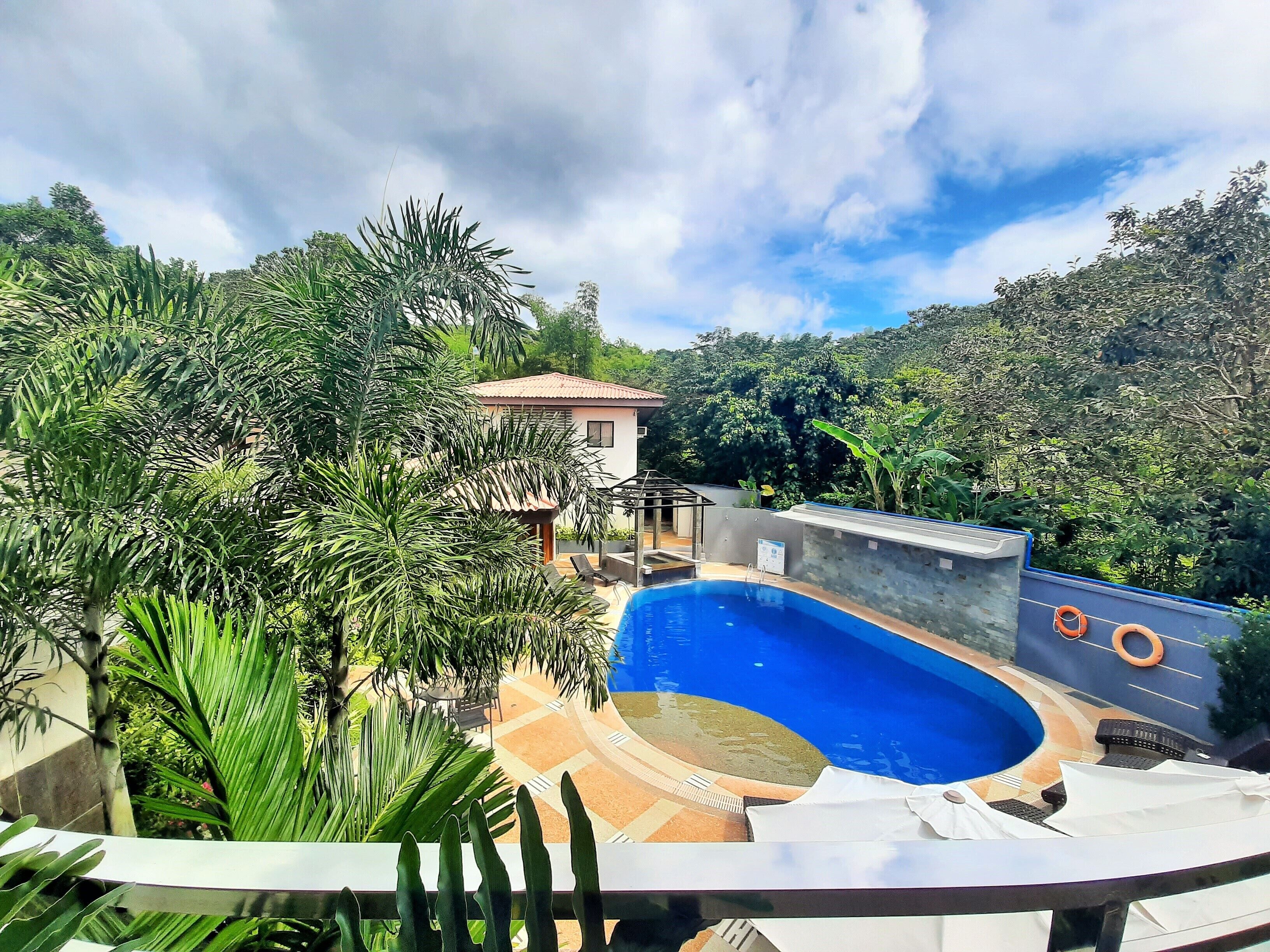 outdoor pool, open 8:00 am to 10 pm, pool umbrellas, pool loungers