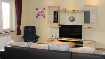 TV, DVD player, foosball, books