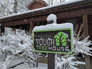 Escape to the Yough Treehouse, a cozy cabin-style retreat nestled among the trees.