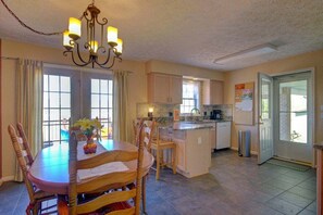 Enjoy meals in the kitchen with a central island, ample counter space, and a dining area.