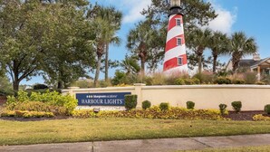 A lighthouse with a sign for BlueGreenVacations' Harbour Lights. - Harbour Lights™ - 1 Bedroom Deluxe (Myrtle Beach)