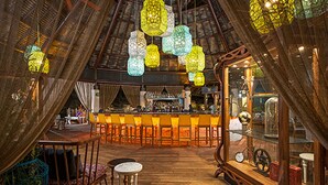 An interior with a bar area, wooden flooring, and hanging lanterns. - Cancun Grand Mayan Master Room, 2 Adults, 2 children (Playa del carmen)
