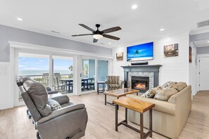 TV, fireplace, books, music library