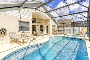 A swimming pool with lounge chairs and a covered patio area. - Jabba the House – Southern Pool, Star Wars Themed! (Kissimmee)