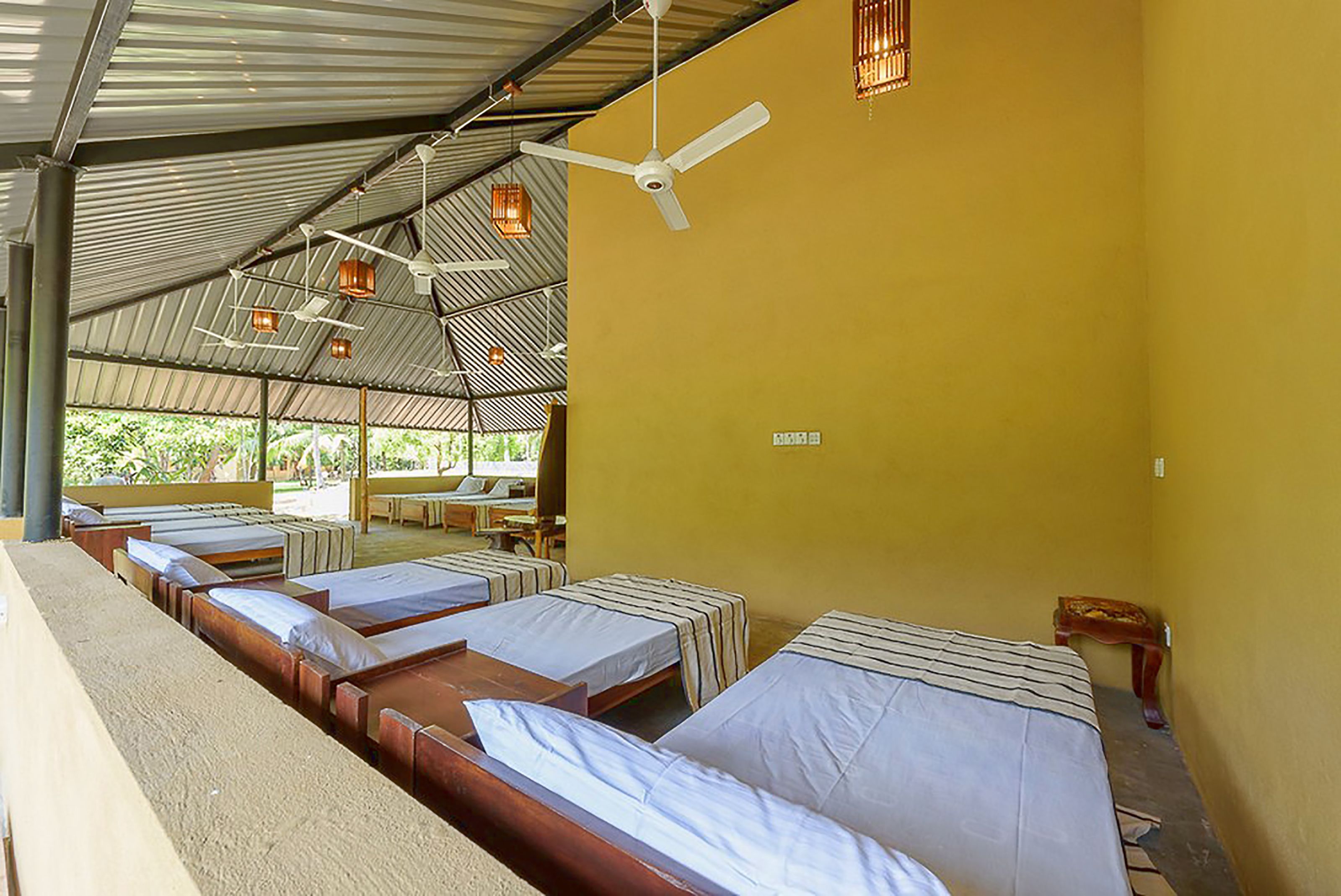 room for 10 people with shared bathroom and fan | free wifi, bed sheets