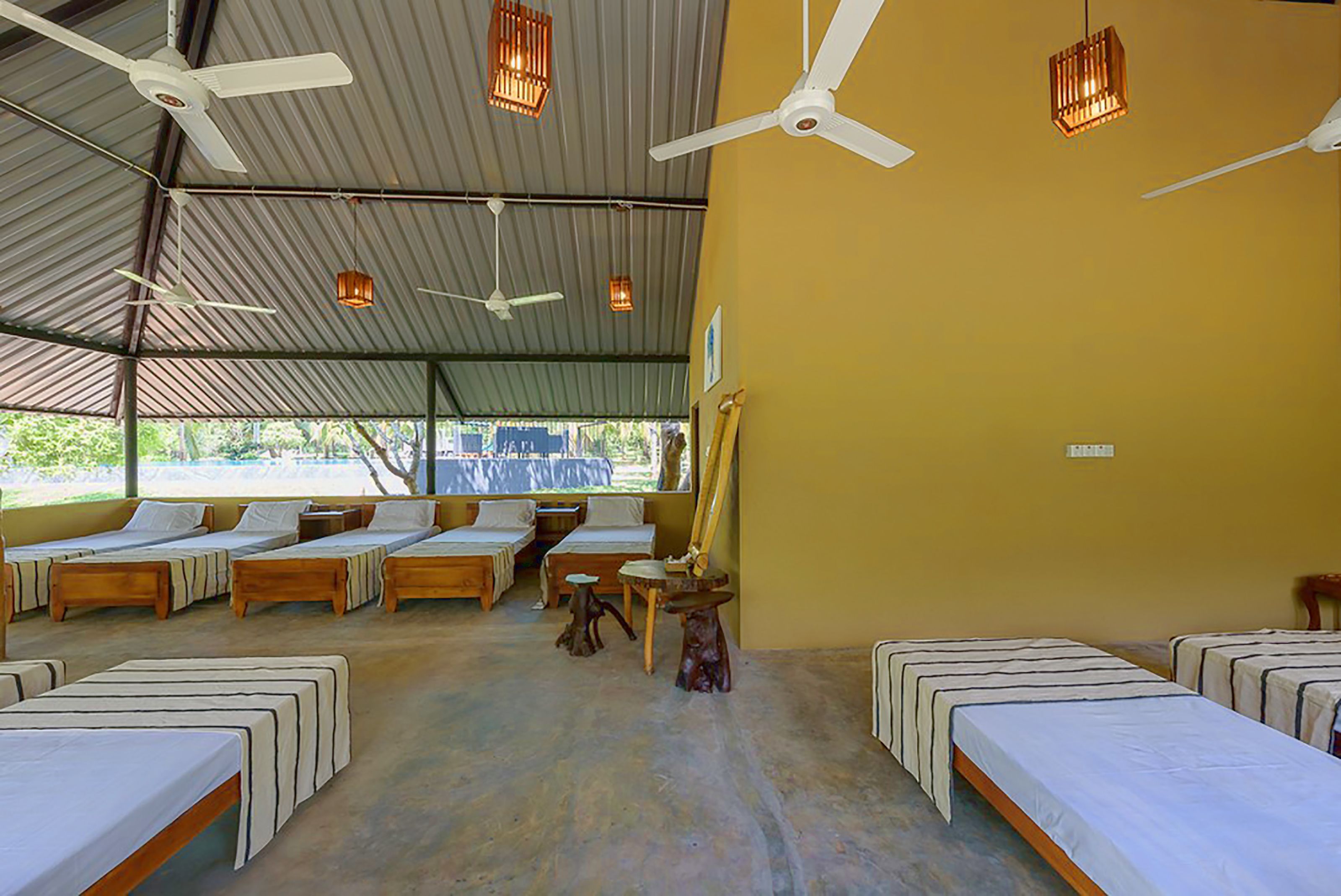 room for 10 people with shared bathroom and fan | free wifi, bed sheets