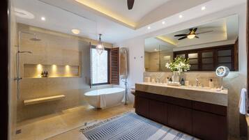 Bathtub, hair dryer, towels, soap