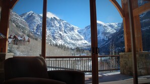 A room with a large window offering a view of snow-covered mountains. - Family, Friends and Festivals! Enjoy Telluride at its Finest! (Telluride)
