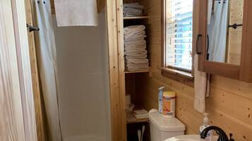 Shower, towels, soap, toilet paper