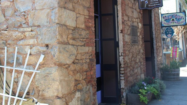 A stone building with a sign for 'La Cortez' and a 'Tea & Tacos' sign. - The Decanted Chateau; a two minute drive to Downtown Murphys (Vallecito)
