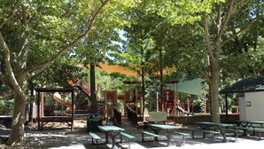 A park with picnic tables, playground equipment, and a covered seating area. - The Decanted Chateau; a two minute drive to Downtown Murphys (Vallecito)