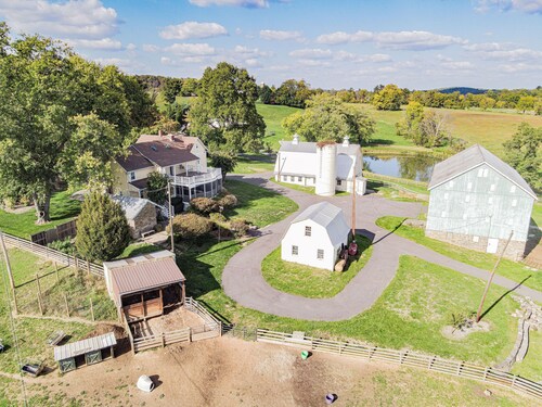 Historic 70-Acre Farm with Porches, Animals & Ponds