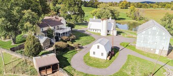 Historic 70-Acre Farm with Porches, Animals & Ponds