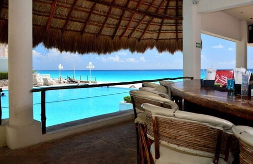 ! GROUND FLOOR! PRIVATE YARD! Pool level Steps to the beach!