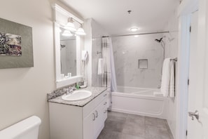 Bathtub, hair dryer, towels, soap