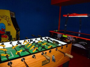 Enjoy a game of foosball in this room with a foosball table.
