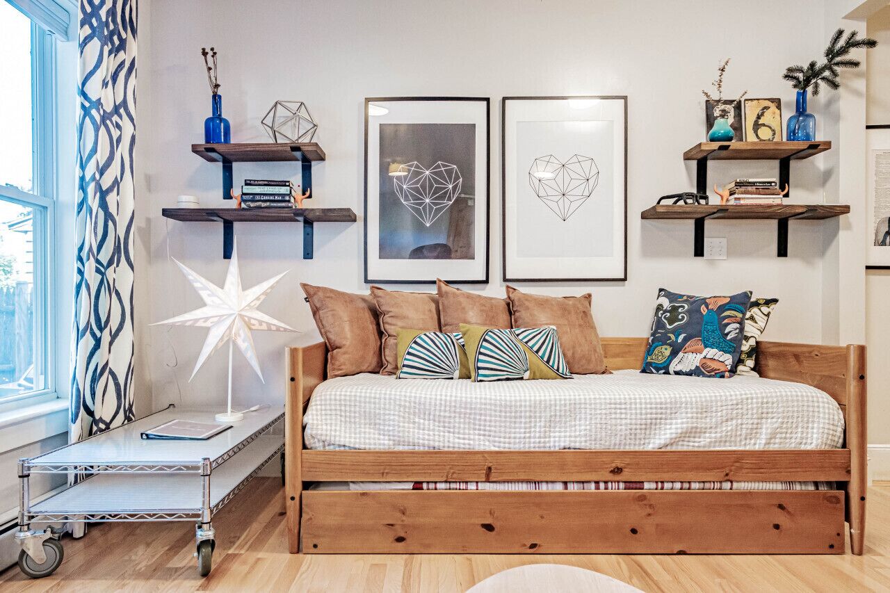 Day bed with trundle and two twin mattresses in living room