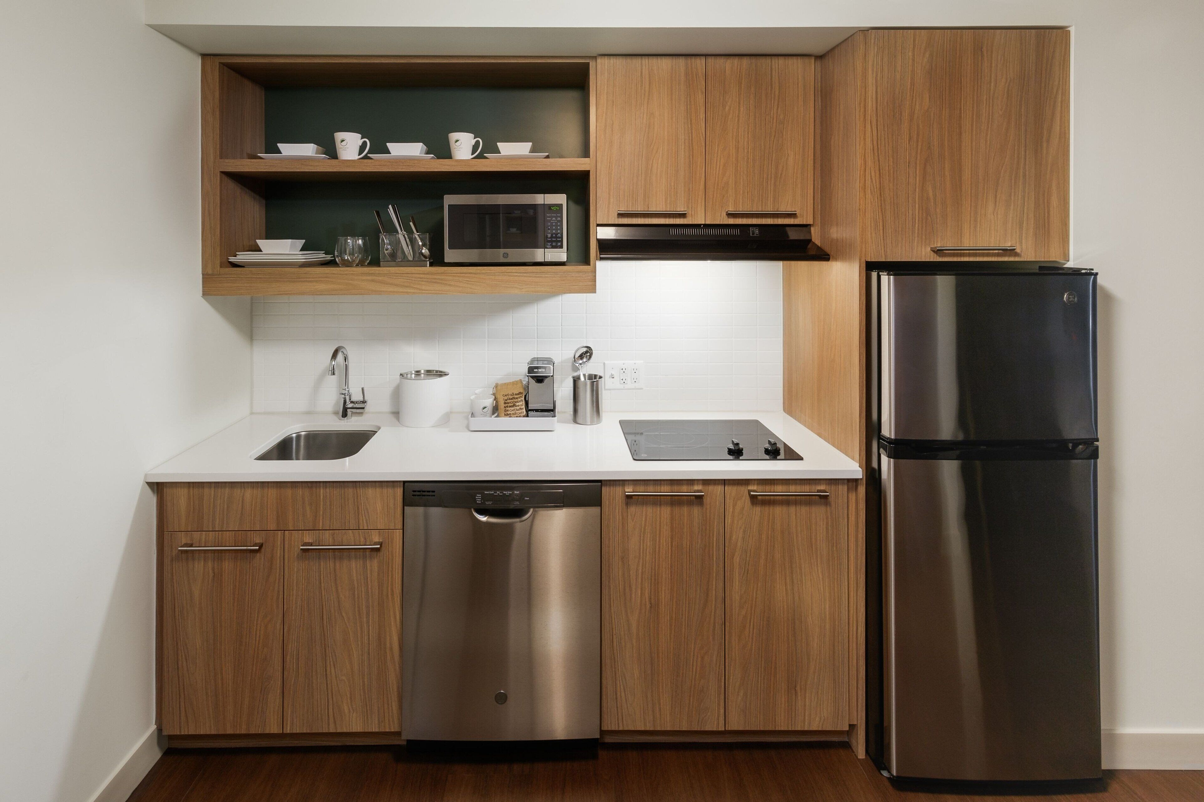 microwave, coffee/tea maker, toaster, cookware/dishes/utensils