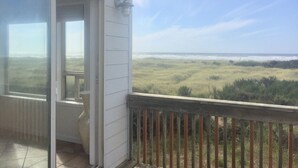 A balcony with a view of the beach and dunes. - Pacific Dreams Beach House- Beach front! Gorgeous views! Meticulously sanitized! (Grayland)