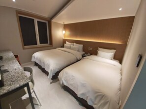 Habitación Deluxe con 2 camas individuales | Edredón, camas con efecto memoria, wifi gratis y ropa de cama 