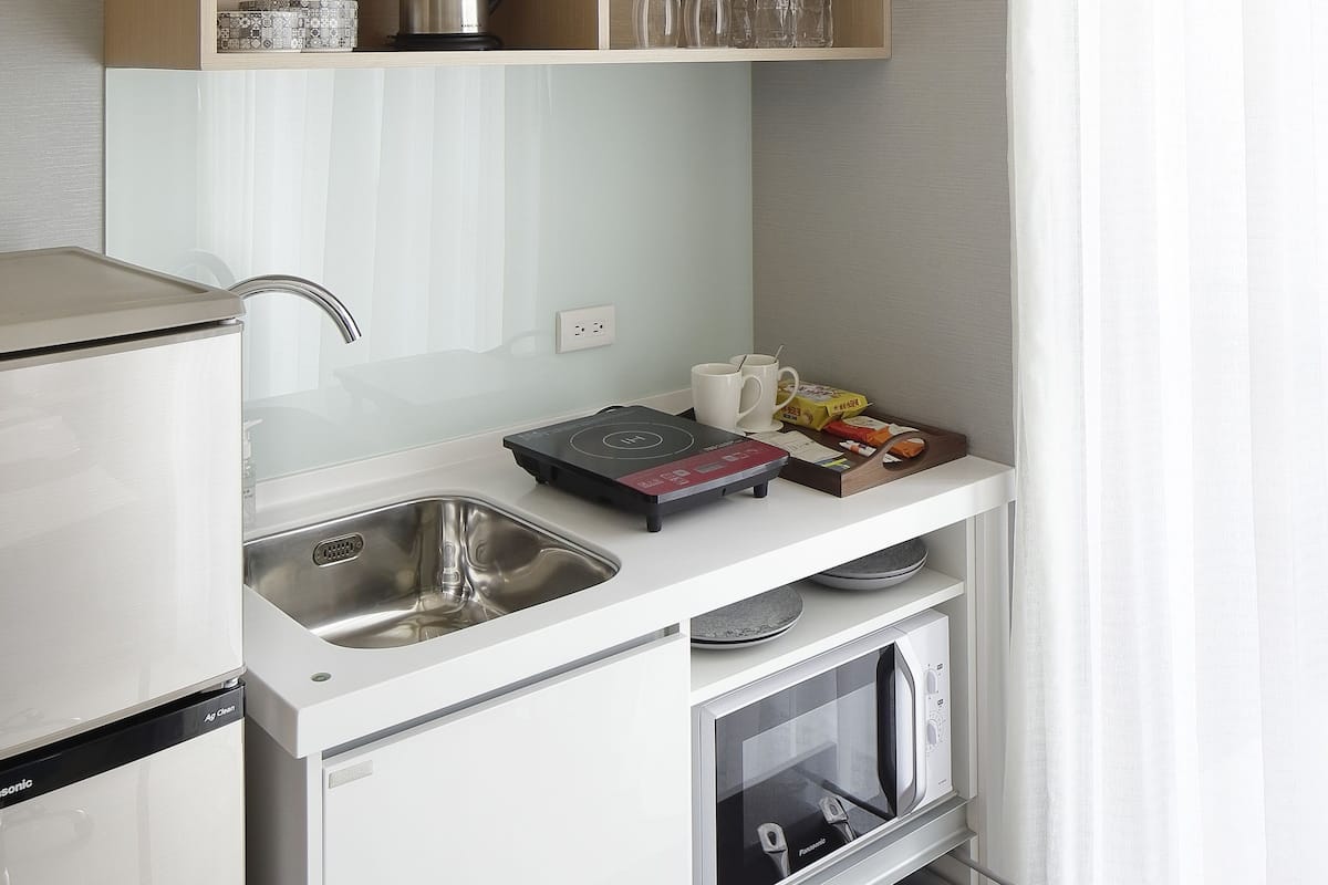 fridge, electric kettle, cookware/dishes/utensils