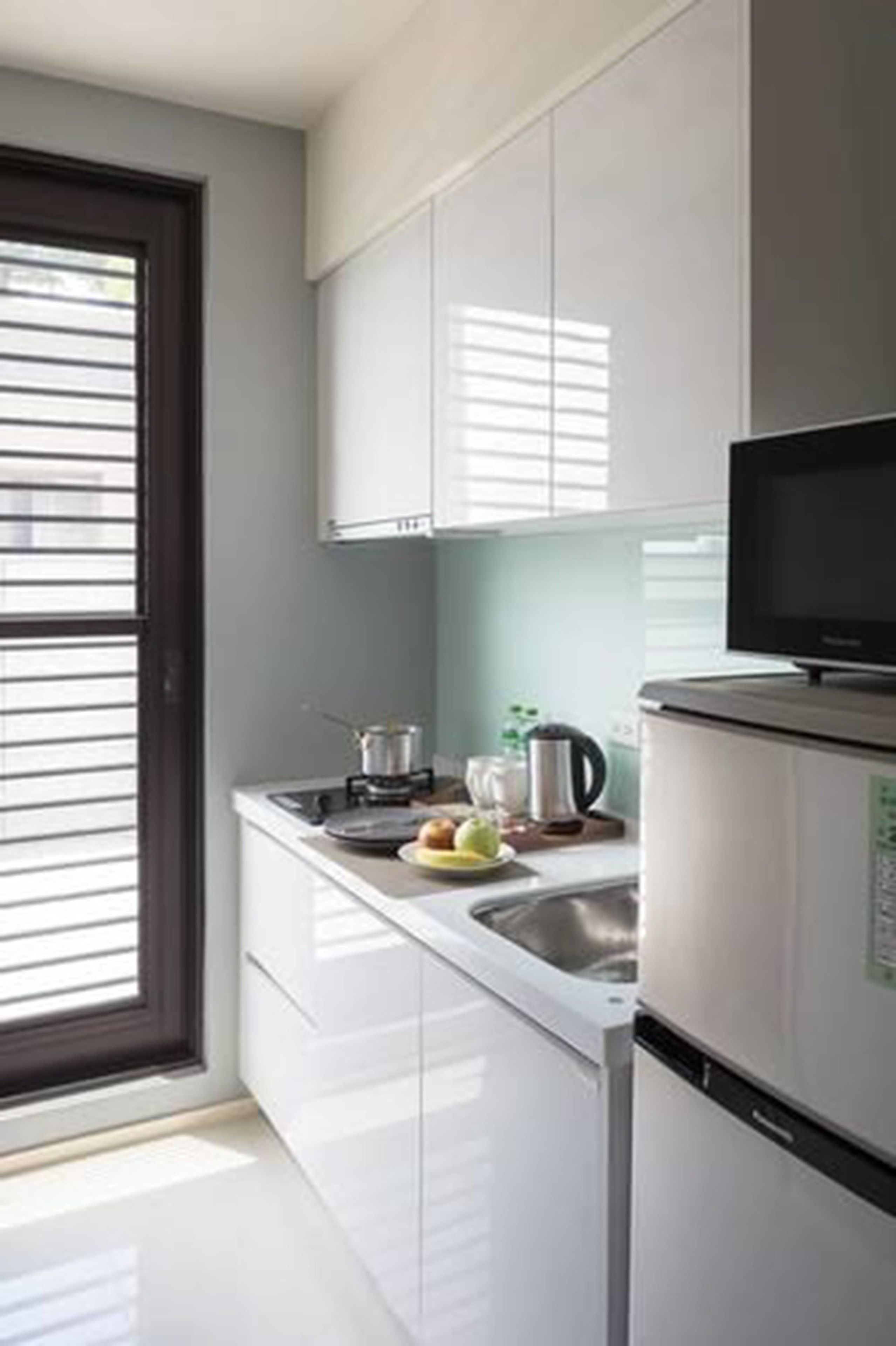 fridge, electric kettle, cookware/dishes/utensils