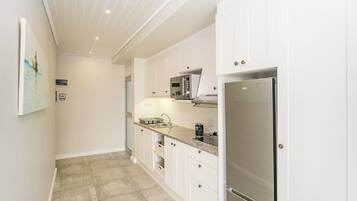 Departamento, varias camas, para no fumadores | Cocina privada | Refrigerador con congelador, microondas y parrilla de estufa