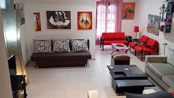 Dúplex Elite | Zona de estar | Una televisión de plasma