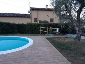 Seasonal outdoor pool, pool umbrellas, pool loungers