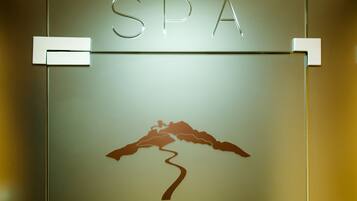 A sign with the letters "SPA" and a mountain silhouette.