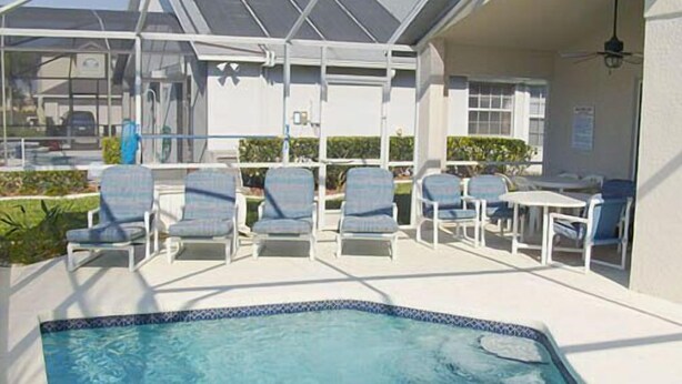 A pool area with lounge chairs and a covered seating area. - Ahr226 - Rolling Hills Estates - 4 Bed 3 Baths Villa (Kissimmee)