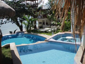 Outdoor pool, open 6 AM to 11 PM, pool umbrellas, sun loungers