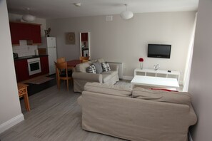 Deluxe Apartment, Multiple Beds, Non Smoking | Living area | LCD TV, Netflix