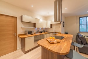 Deluxe Apartment, 2 Bedrooms, Non Smoking | Private kitchen | Full-size fridge, microwave, oven, stovetop