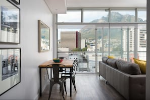 Deluxe Apartment | Living area | Flat-screen TV