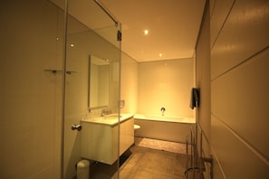 Comfort Apartment | Bathroom | Separate tub and shower, deep soaking tub, rainfall showerhead