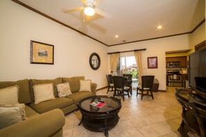 Deluxe Condo, 1 King Bed with Sofa bed (Los Suenos Resort Veranda 5A) | Living room | Flat-screen TV