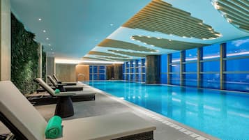 Indoor pool, open 7:00 AM to 11:00 PM, lifeguards on site