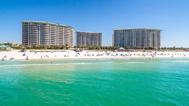 A beachfront hotel with multiple high-rise buildings, a sandy beach, and clear turquoise waters. - St. Croix  #805, Awesome View From Every Room! (Destin)