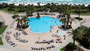 A resort with a large central pool, a beach area, and palm trees. - St. Croix  #805, Awesome View From Every Room! (Destin)
