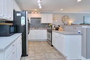 Private kitchen - Experience ocean views at Oak Island OW 5104, a spacious 3-bedroom condo for 8. (Oak Island)