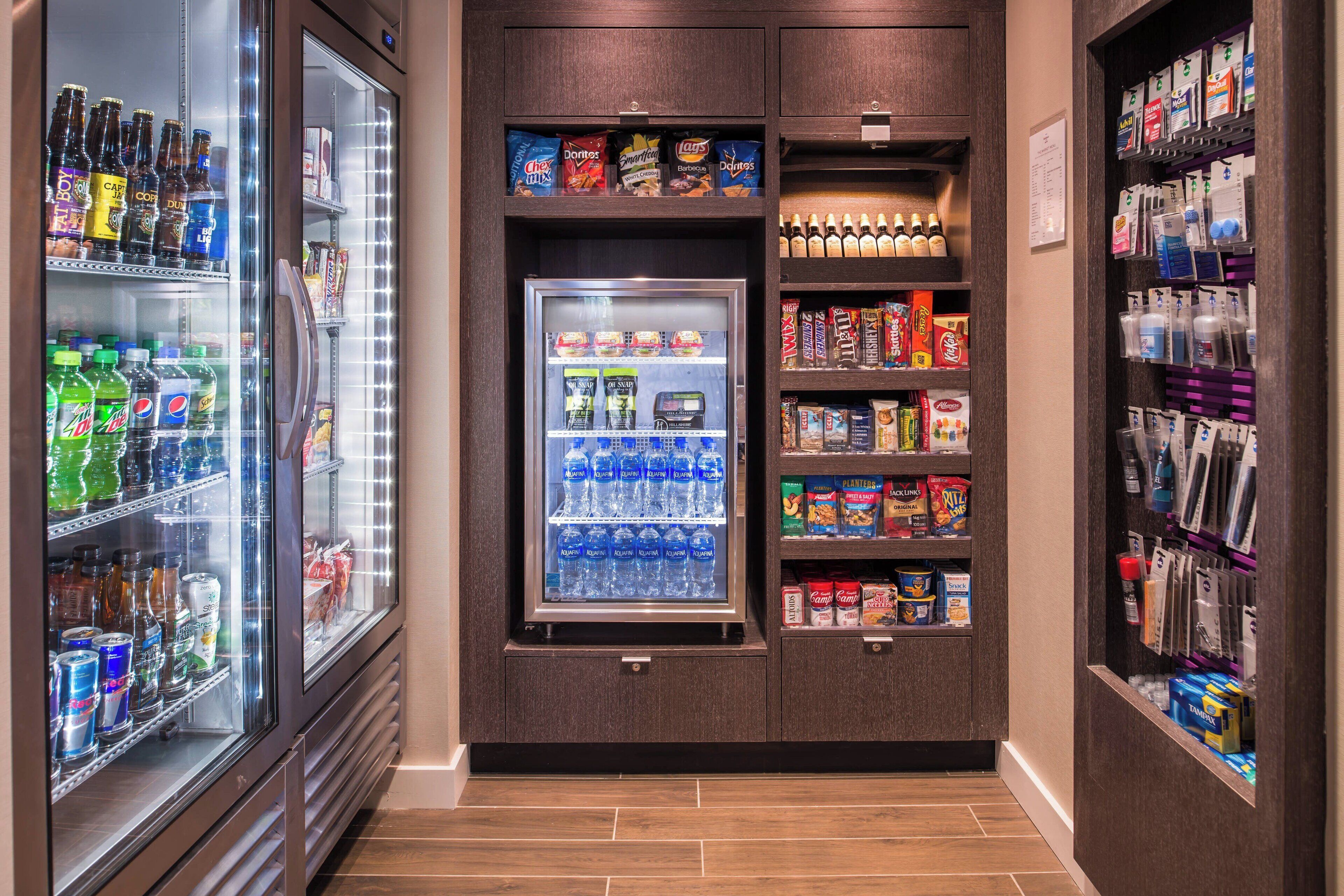 A vending machine area with various snacks, drinks, and beverages.