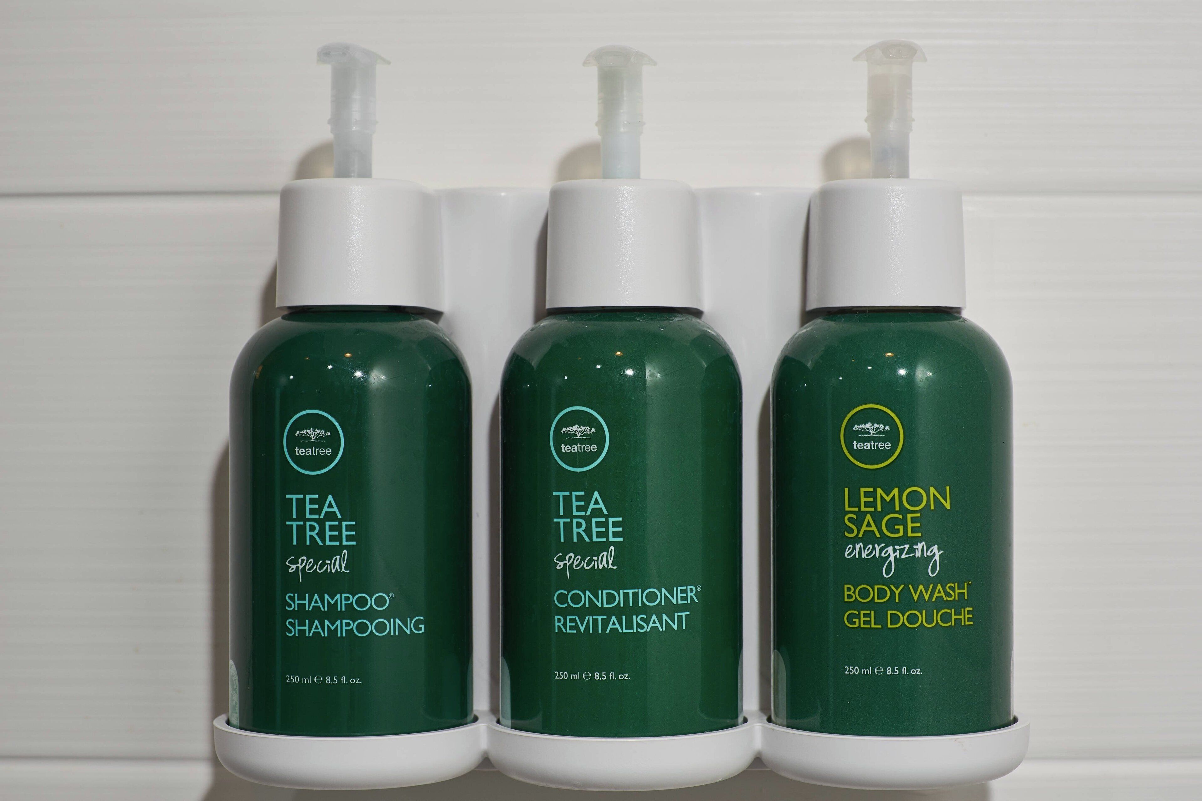 Three bottles of Tea Tree Special products: Shampoo, Conditioner, and Body Wash.