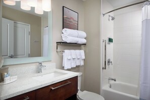 A bathroom with a sink, mirror, toilet, and bathtub. - TownePlace Suites by Marriott Fort Worth Northwest/Lake Worth (Fort Worth)