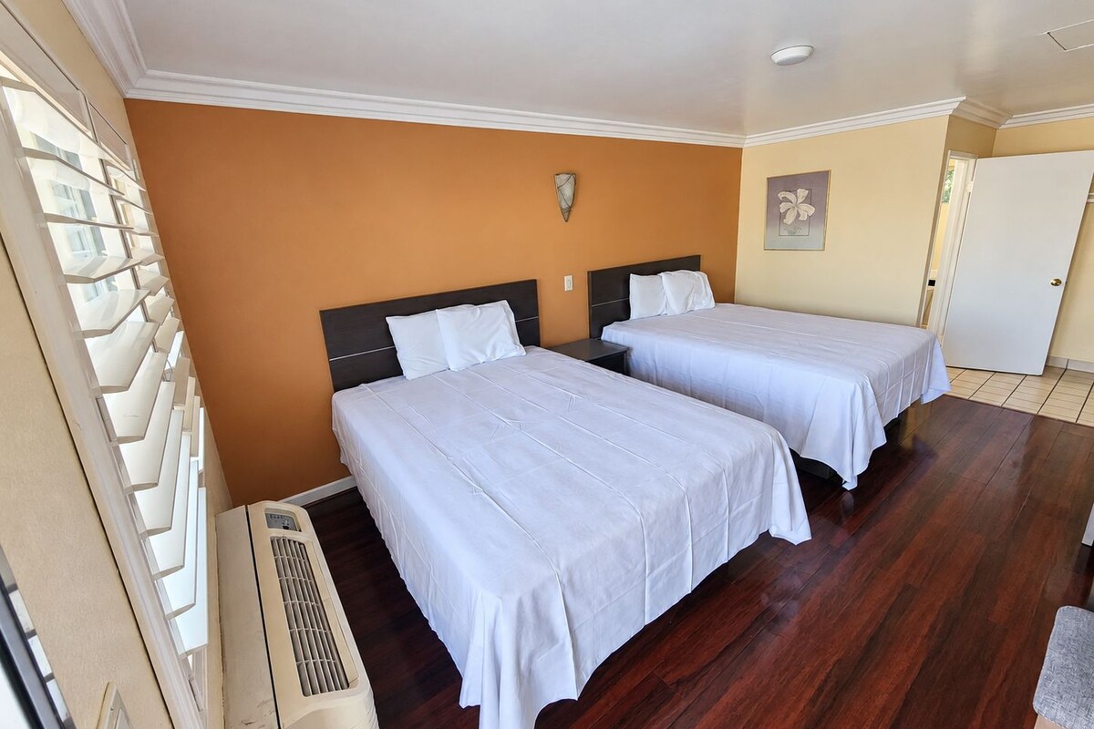 Standard Room, 2 Queen Beds, Non Smoking, Garden View | Desk, WiFi (free), bed sheets