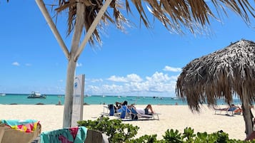 On the beach, sun loungers, beach towels