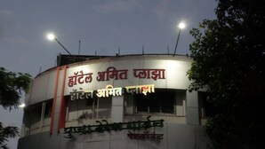 A hotel with a sign in multiple languages, including English and Hindi. - Hotel Amit Plaza (Dhule)