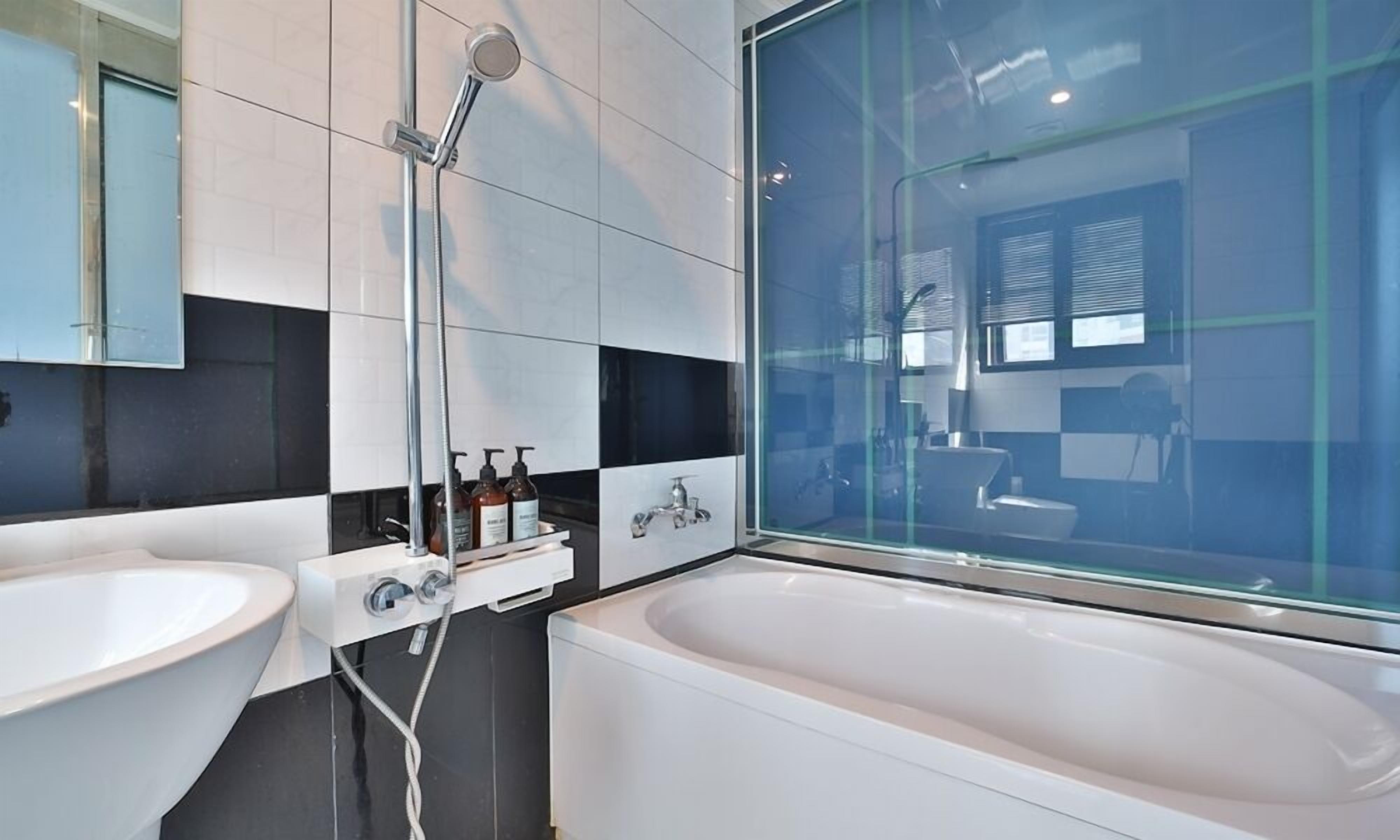 separate bathtub and shower, free toiletries, hair dryer, slippers